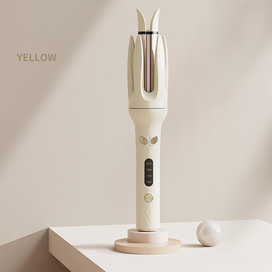 The LAMORE automatic curler in yellow